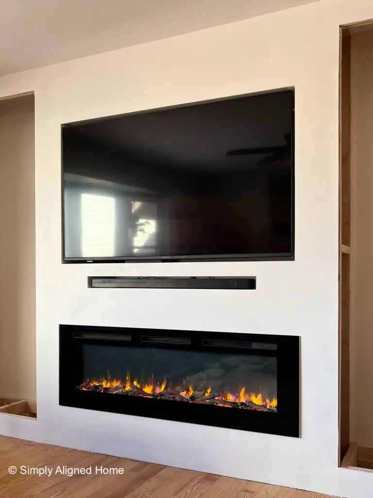 Simply Aligned Home Electric Fireplace Built In with Inset TV Sounbar and Fireplace Installed